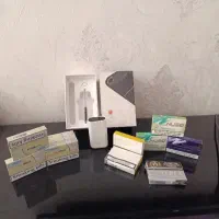 دستگاه ایکاس با چند بسته سیگار هیتس