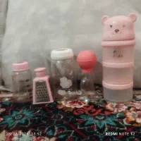 شیشه شیر و محافظ کهنه و لاستیک چهار گیربچه با کهنه