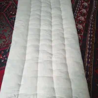 کار لحاف و تشک و بالش دوزی در خانه انجام میشود
