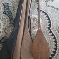 دوتار به همراه کیف