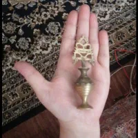 سرمه دادن برنجی قدیمی .زنگوله برنجی