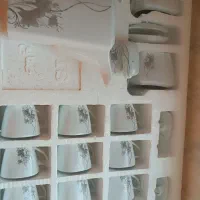 فنجان و قوری وقندان شکر پاش