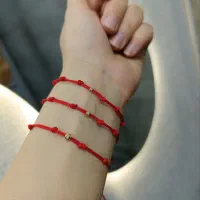 دستبند هفت گره با گوی نقره و طلا