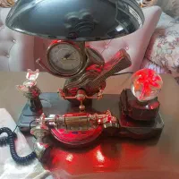 تلفن رومیزی و ساعت و شب خواب