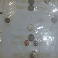 تعدادی سکه و پوند انگلیس