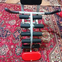 دستگاه دراز نشست و کفش ورزشی