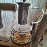 دمنوشته لیوانی وقوری با شمع نو