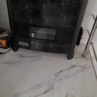 بخاری .کابینت .پرده