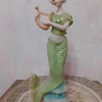 مجسمه پری دریایی و فلامینگو وخرس