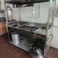 یک دستگاه گریل ساندویچ سه کاره و یک کولر ابی ۶۰۰۰