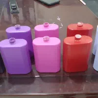 شیشه عطر ۱۰۰ میل با در و پمپ رنگ شده کوره ای
