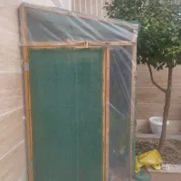 گلخانه و مقداری گیاه