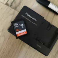 رم 16 سندیسک اصلی دوربین و شارژر و دانگل وای فای