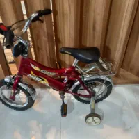 دوچرخه ۱۲ همراه بایک جفت  کمکی