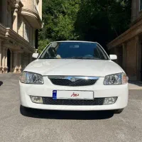 مزدا ۳۲۳ سفید دوررنگ شاسی سالم خوش رخ