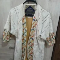 مانتو مجلسی درحدنو و یک تابلو فرش نو و دیگ مسی