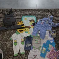 آغوشی و لباس نوزاد در حد نو
