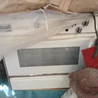 اجاق گاز از برند بوتان فر دار کارکرده اما تمیز