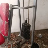 دو عدد دستگاه ورزشی فلای وجلو پا و راک دمبل ۹