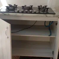 اجاق گاز رو میزی شیشه  ای جنس کابینت ام دی اف
