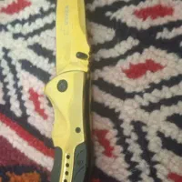 چاقو نو نو طلایی رنگ ثابت با غلاف کمری