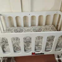 گهواره کنار تخت مادر