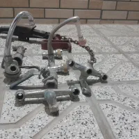 تعدادی شیرآلات برنجی،جک پرایدی،زنجیر،کلاه ایمنی