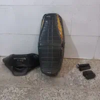 زین هوندا و شیشه راهنما و لاستیک رکاب و دسته گاز
