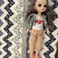 عروسک موزیکال چشم تیله ای نو