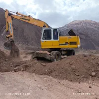 بیل مکانیکی لاستیکی اجاره وتخریب