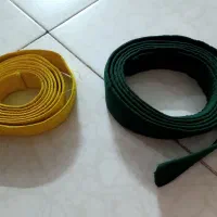 کمربند تکواندو در دو رنگ زرد و سبز