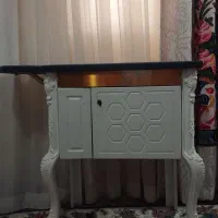 میزاتو و جای چرخ خیاطی