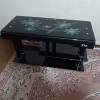 میز تلویزیون شیشه ای خم