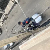 خدمات برق ساختمان وخط تلفن ودوربین وکار در ارتفاع