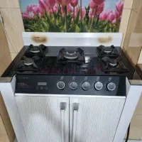 اجاق گاز ،صفحه شیشه ای سالم،دارای فندک