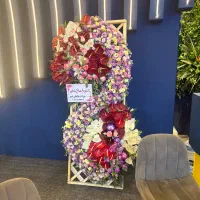 کد82 تحویل درب غرفه داخل نمایشگاه تاجگل دسته گل