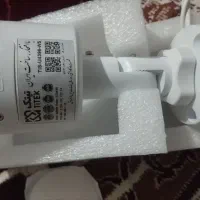 یک عدد دوربین تیتک نو و یک عدد باطری خشک رک
