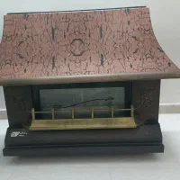 بخاری گازی طلائی مدل شومینه