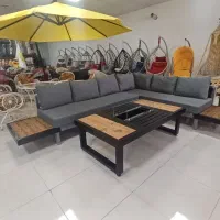 میز آتشدان و نشیمن ال شکل دکوراسیون فضای باز