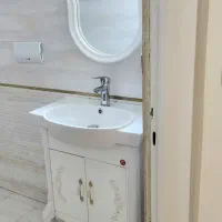 روشویی کابینتی سلطنتی و آینه و شیر روشویی