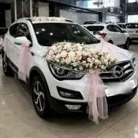 اجاره ماشین عروس همراه با گل ارایی