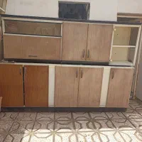 کابینت آشپزخانه همراه با سینگ و آب چکان