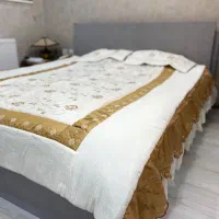 رو تختی بهمراه دو عدد رو بالشتی