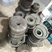 تعداد 33عددچرخ دنده چدنی مدول 2.5باشفت محور قطر35