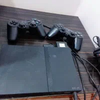 یک دستگاه ps2  و تلویزیون