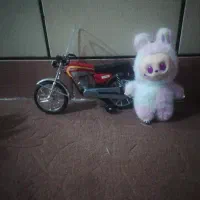 عروسک لبوبو و ماکت موتور