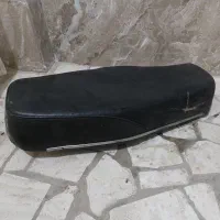 زین موتور سی جی و کلاه ایمنی