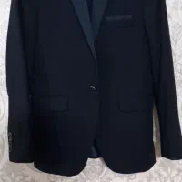 یک دست کت و شلوار در حدنو