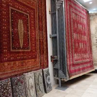فرش ۱۲ متری بلوچی ااکی زرشکی گالری نگارین کد ۰۲۲