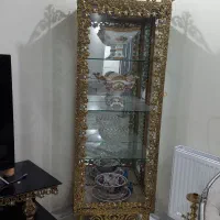 ویترین تمام برنجی سالم صد در صد برنج پشت اینه
